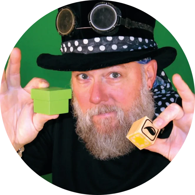 Steve Trash holding magic props during a STEAM Magic assembly